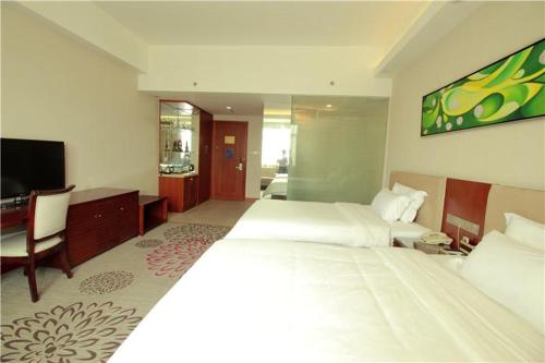 Ένα ή περισσότερα κρεβάτια σε δωμάτιο στο Lavande Hotel Dongguan Tangxia Branch