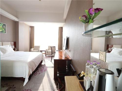 Ένα ή περισσότερα κρεβάτια σε δωμάτιο στο Lavande Hotel Dongguan Tangxia Branch