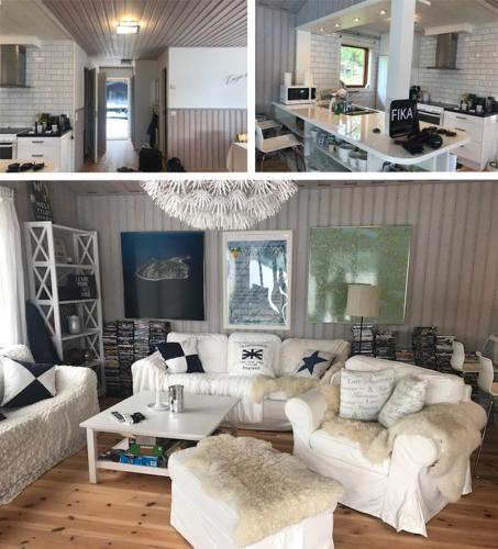 a living room with white couches and a table at Galasjön 132 in Mellansel
