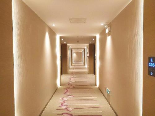 a hallway with a long corridor with lights at Lavande Hotel Jinan Second Ring East Road Quanfu Overpass Branch in Jinan