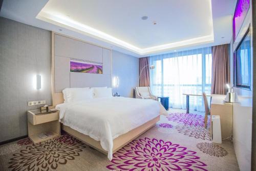 Säng eller sängar i ett rum på Lavande Hotel Jiujiang Railway Station Branch