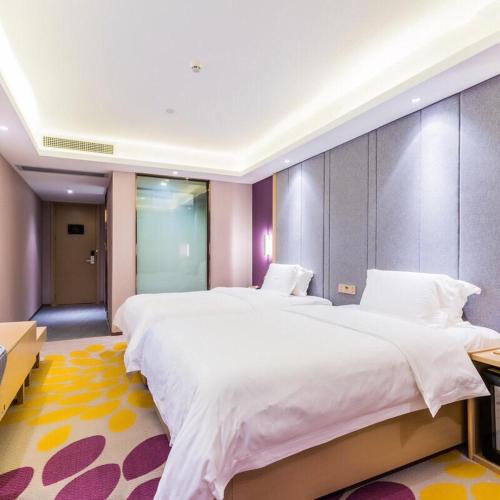 Katil atau katil-katil dalam bilik di Lavande Hotel (Gaozhou Xiantai Bridge Branch)