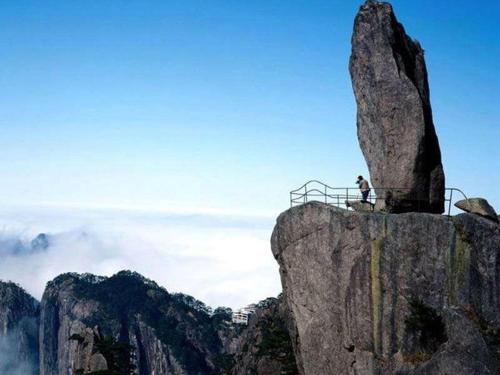 a person standing on top of a mountain at Lavande Hotel(Macheng High-speed Station Branch) in Macheng