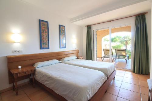 Postel nebo postele na pokoji v ubytování Chalets Torre Nova