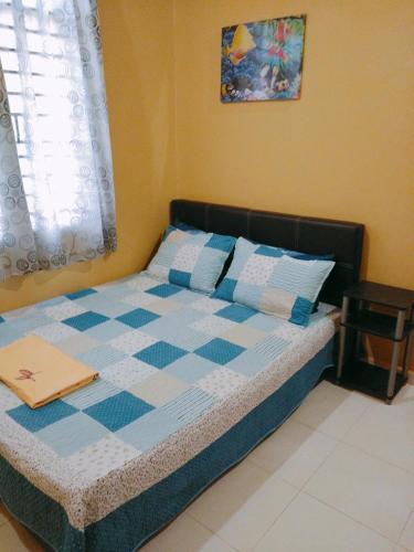Postel nebo postele na pokoji v ubytování Davallia Homestay