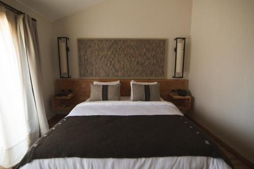 Hotel Casa Solaria房間的床