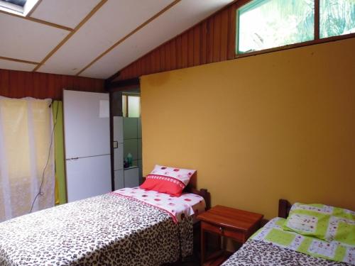 Voodi või voodid majutusasutuse Villa Hermosa de Tambopata Casa Hospedaje & Hostel toas
