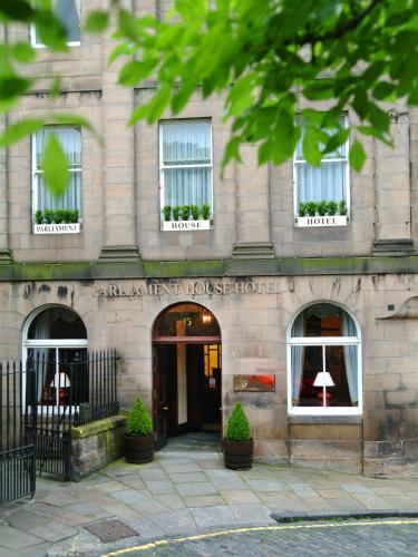 a stone building with windows and a door at The Parliament House Hotel in Edinburgh