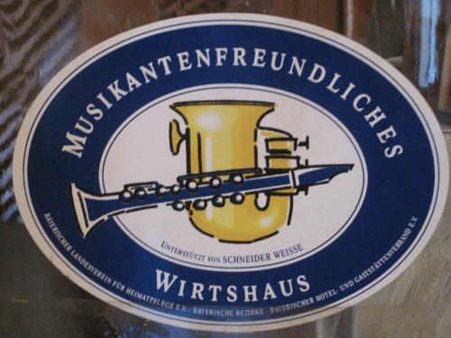 a label for a bottle of wine with a sword at Gasthof Eggwirt in Ultimo