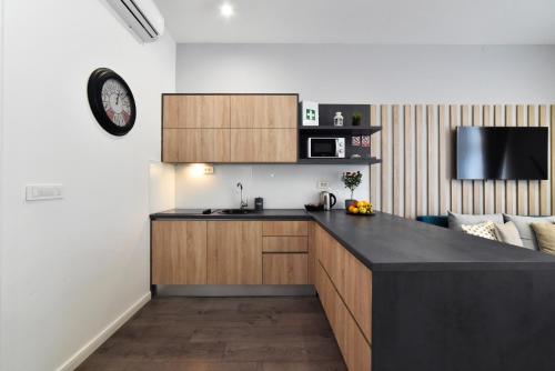 a kitchen with a counter top and a microwave at Time Studios - Central Zagreb in Zagreb