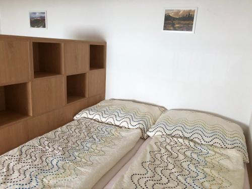 Säng eller sängar i ett rum på Loučná - Apartmán Daňovi