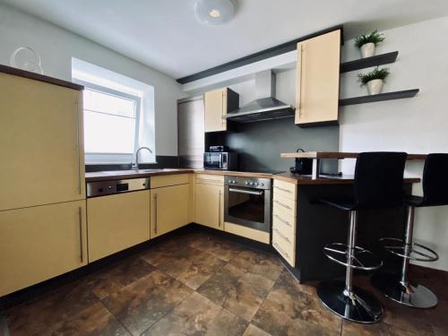 Kuchyňa alebo kuchynka v ubytovaní Luxuriöses und modernes Apartment zum Wohlfühlen