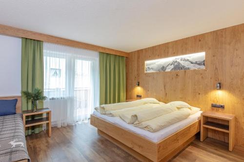 Postel nebo postele na pokoji v ubytování Haus Manfred