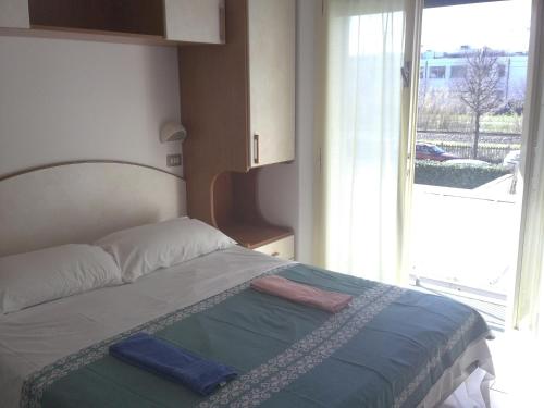 Postel nebo postele na pokoji v ubytování Hotel Magda