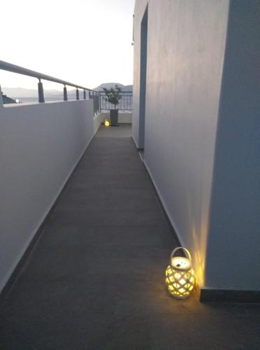 a light bulb sitting on the floor of a building at Alexandra`s House in Matala