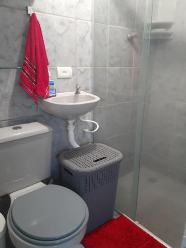 a bathroom with a toilet and a sink and a shower at Apartamento Centro de Convenções in Recife