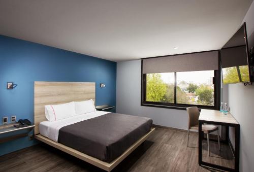 Llit o llits en una habitació de Hotel MX lagunilla