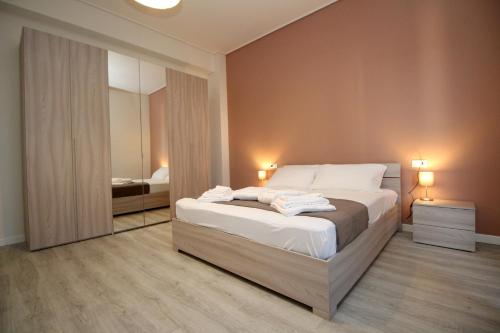 Posteľ alebo postele v izbe v ubytovaní Residenza Bonomi 23