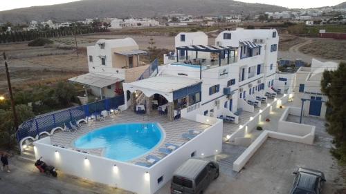 an aerial view of a villa with a swimming pool at Honeymoon Beach Studios in Perivolos
