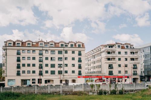 two tall buildings next to each other at PENSIÓN AUGAS QUENTES in Caldas de Reis