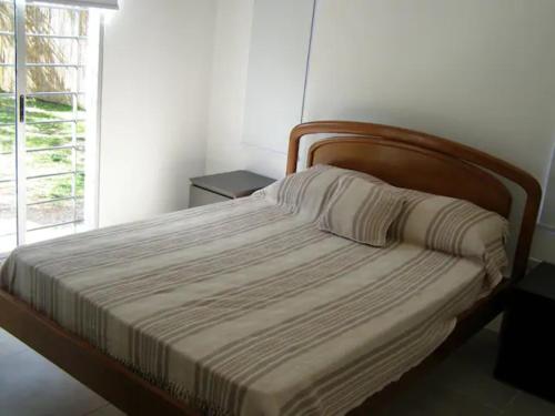 מיטה או מיטות בחדר ב-Sabiá