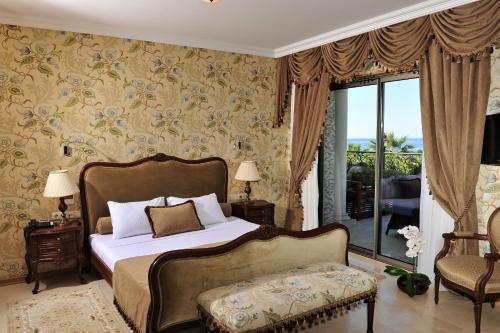 Postel nebo postele na pokoji v ubytování Villa Augusto Boutique Hotel & SPA