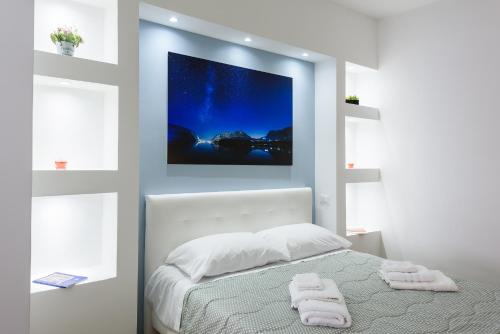 a bedroom with a bed with two towels on it at GUEST HOUSE PIANA DEGLI ALBANESI in Piana degli Albanesi