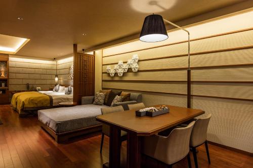 Ένα ή περισσότερα κρεβάτια σε δωμάτιο στο Hokkaido Hotel