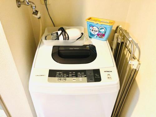 a washer and dryer sitting on top of a wall at エスポアール201 in Kumamoto