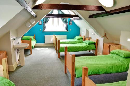 Ένα ή περισσότερα κρεβάτια σε δωμάτιο στο YHA Boscastle