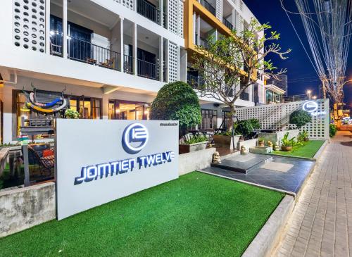 a rendering of the front of a building with a lawn at The Jomtien Twelve in Jomtien Beach