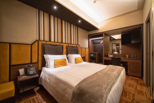 a hotel room with a large bed and a television at Solo Experience Hotel in Florence