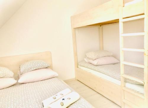 Postel nebo postele na pokoji v ubytování Domki i Apartamenty Całoroczne Koliber