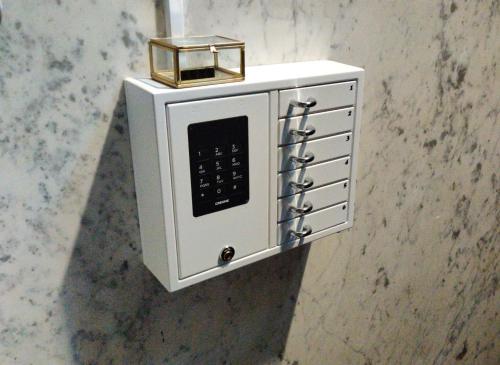 a white microwave with a candle on top of it at B in Antwerp in Antwerp