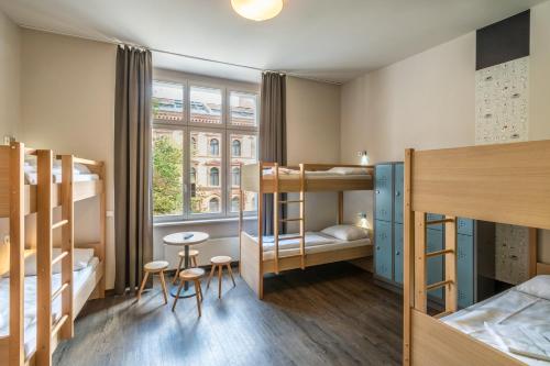 Postel nebo postele na pokoji v ubytování MEININGER Hotel Berlin Mitte