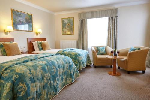 Katil atau katil-katil dalam bilik di Royal York & Faulkner Hotel