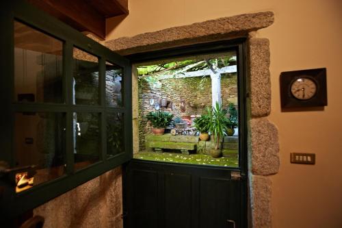 Κήπος έξω από το Casa del Cura de Oliveira