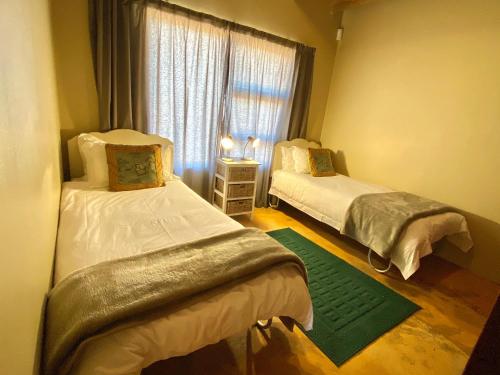Katil atau katil-katil dalam bilik di ParkView Safari Lodge