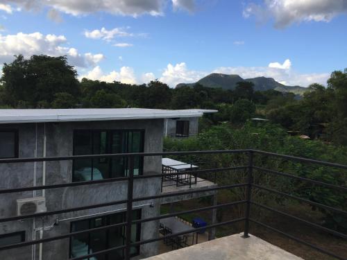 a view from the balcony of a house at ชลลดา ริเวอร์ โฮมสเตย์ แก่งกระจาน in Ban Wang Malako