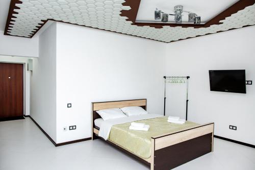Giường trong phòng chung tại Апарт-отель ГОСТИ РУ