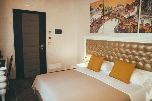 Postel nebo postele na pokoji v ubytování Lighthouse Suites Trastevere