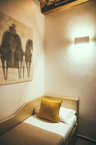Postel nebo postele na pokoji v ubytování Lighthouse Suites Trastevere