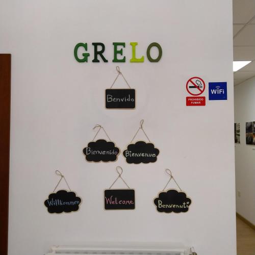 a wall with the word giza and signs on it at Grelo Hostel in Ourense