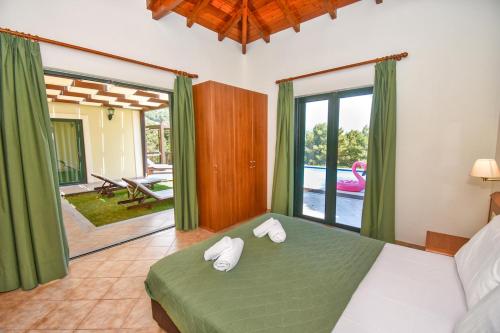 A bed or beds in a room at Corfu Resorts Villas