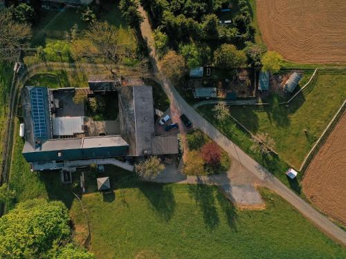 an aerial view of a house in a field at Berghof in Zeulenroda