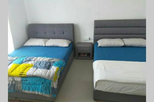 מיטה או מיטות בחדר ב-LOVE LODGE BRINCHANG, CAMERON HIGHLANDS