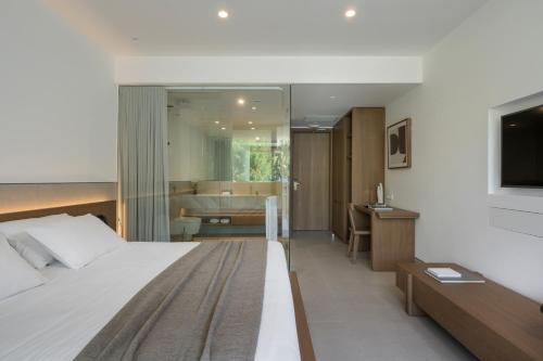 Ένα ή περισσότερα κρεβάτια σε δωμάτιο στο SanSal Boutique Hotel