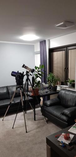 a camera on a tripod in a living room at Hotel GH Kolinska in Bled