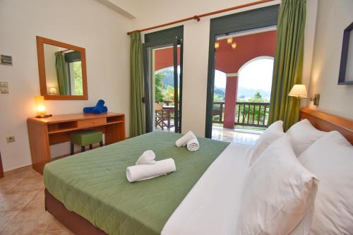 Postel nebo postele na pokoji v ubytování Corfu Resorts Apartments