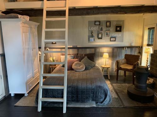 Postel nebo postele na pokoji v ubytování B&B de Tuinfluiter